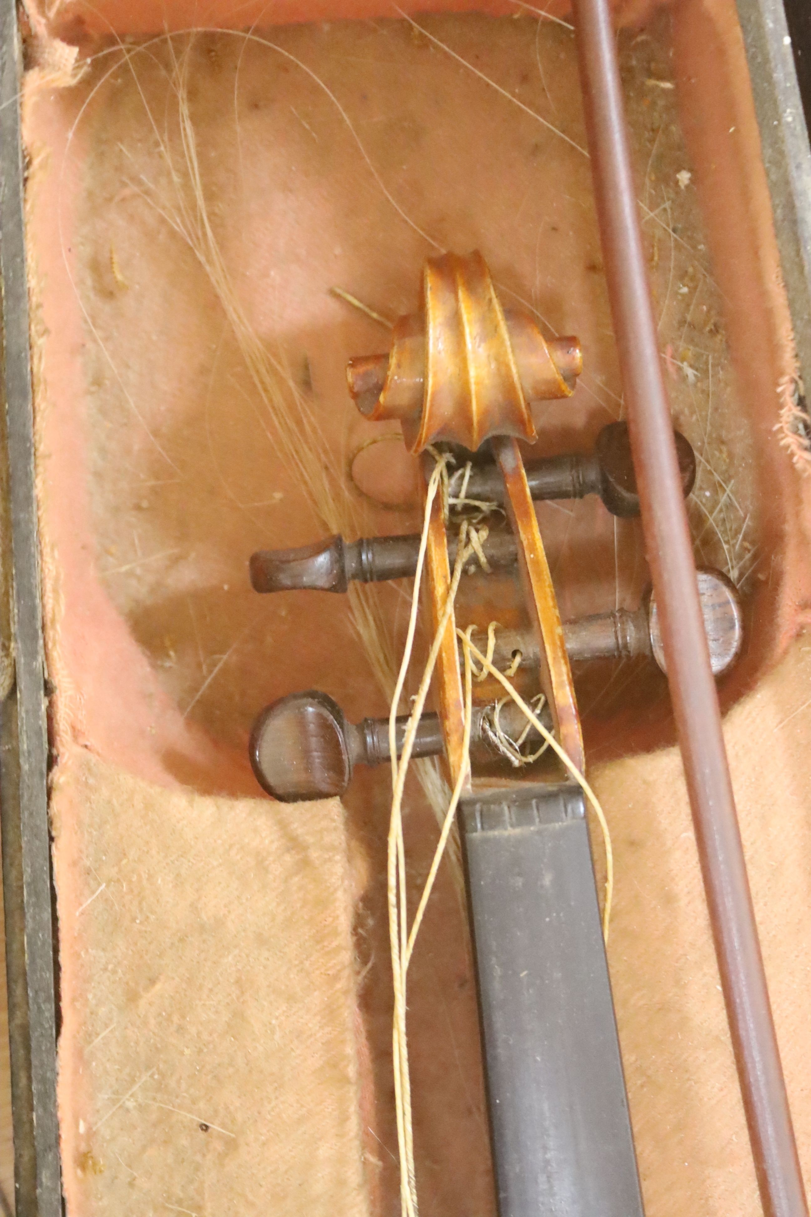 A Stradivarius copy violin and two bows and another bow, both cased, backs 33cm and 30cm